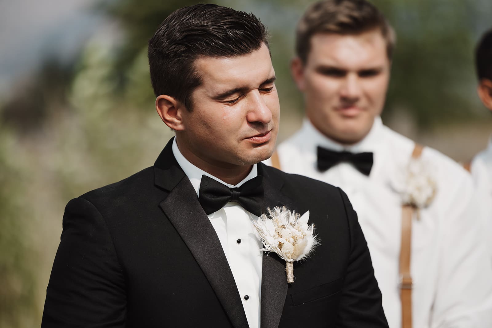 Groom shedding tears as he watches his bride walk down the aisle in bozeman, mt. 