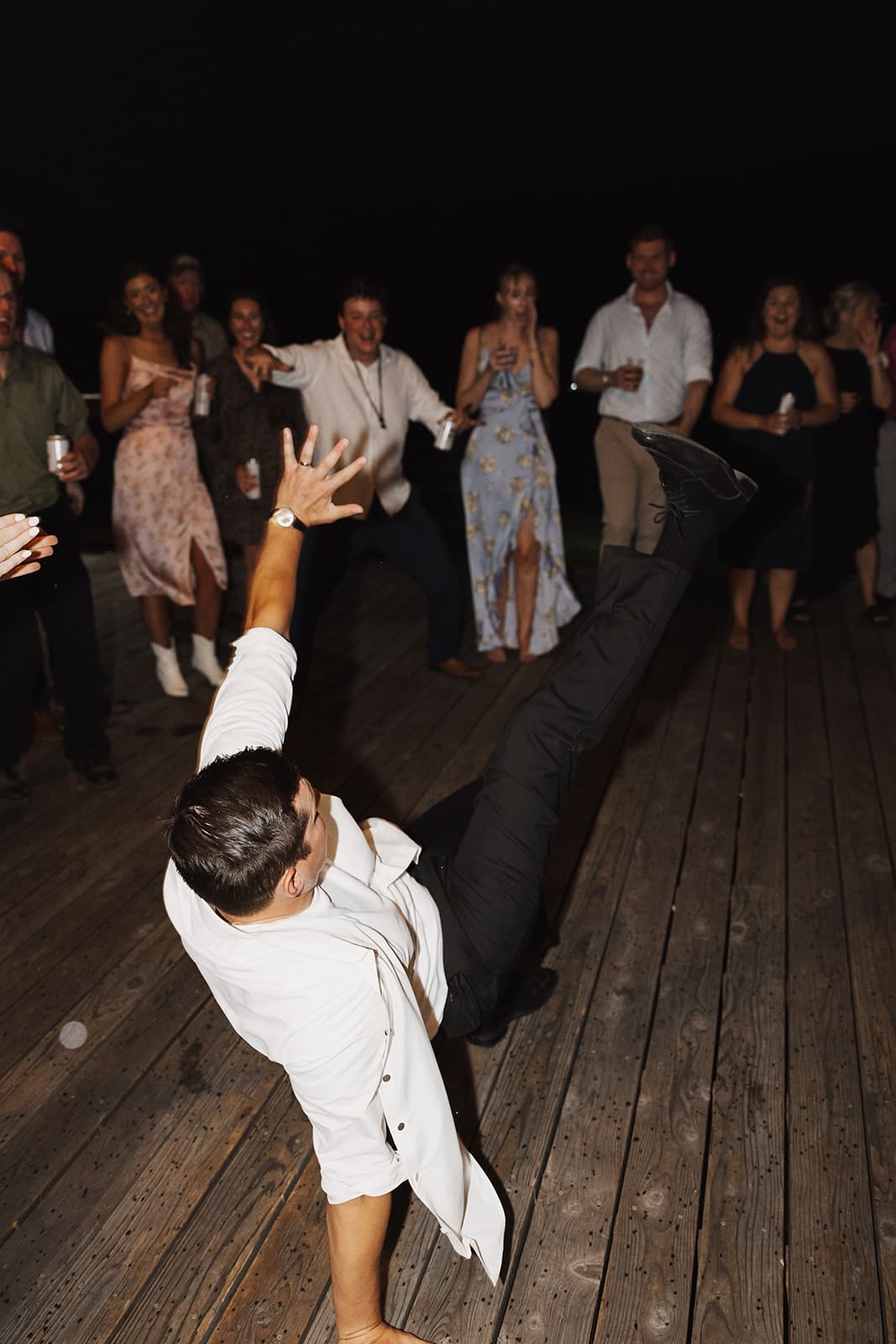 Groom dancing during montana outdoor wedding reception