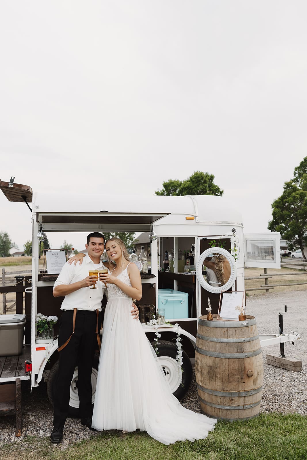 Bride and groom sharing a drink together at their montana wedding