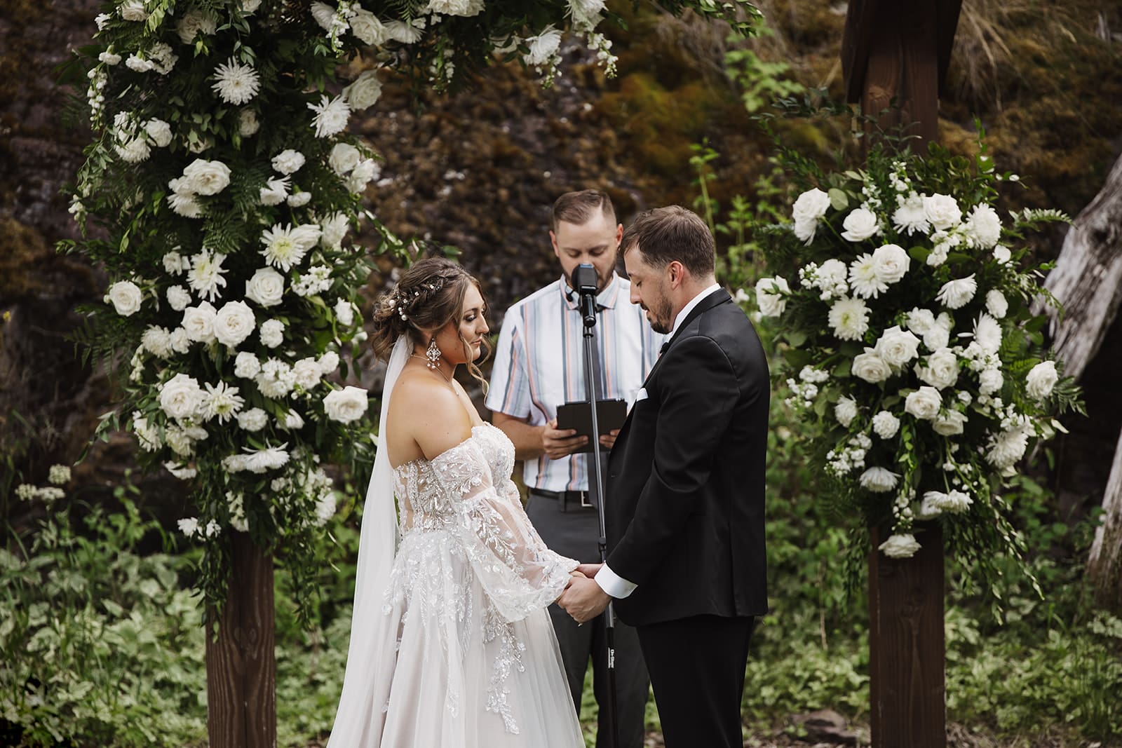 bride and groom at The White Raven in Missoula, Montana, surrounded family and friends at their ceremony