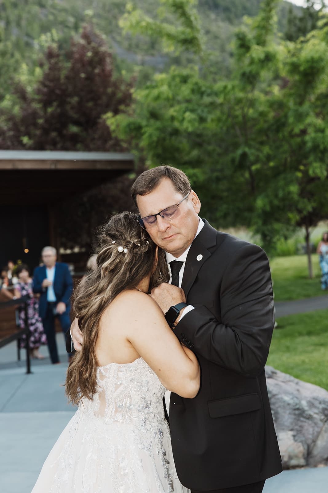 Bride and father share dance during the wedding reception at The White Raven venue in Missoula, Montana.