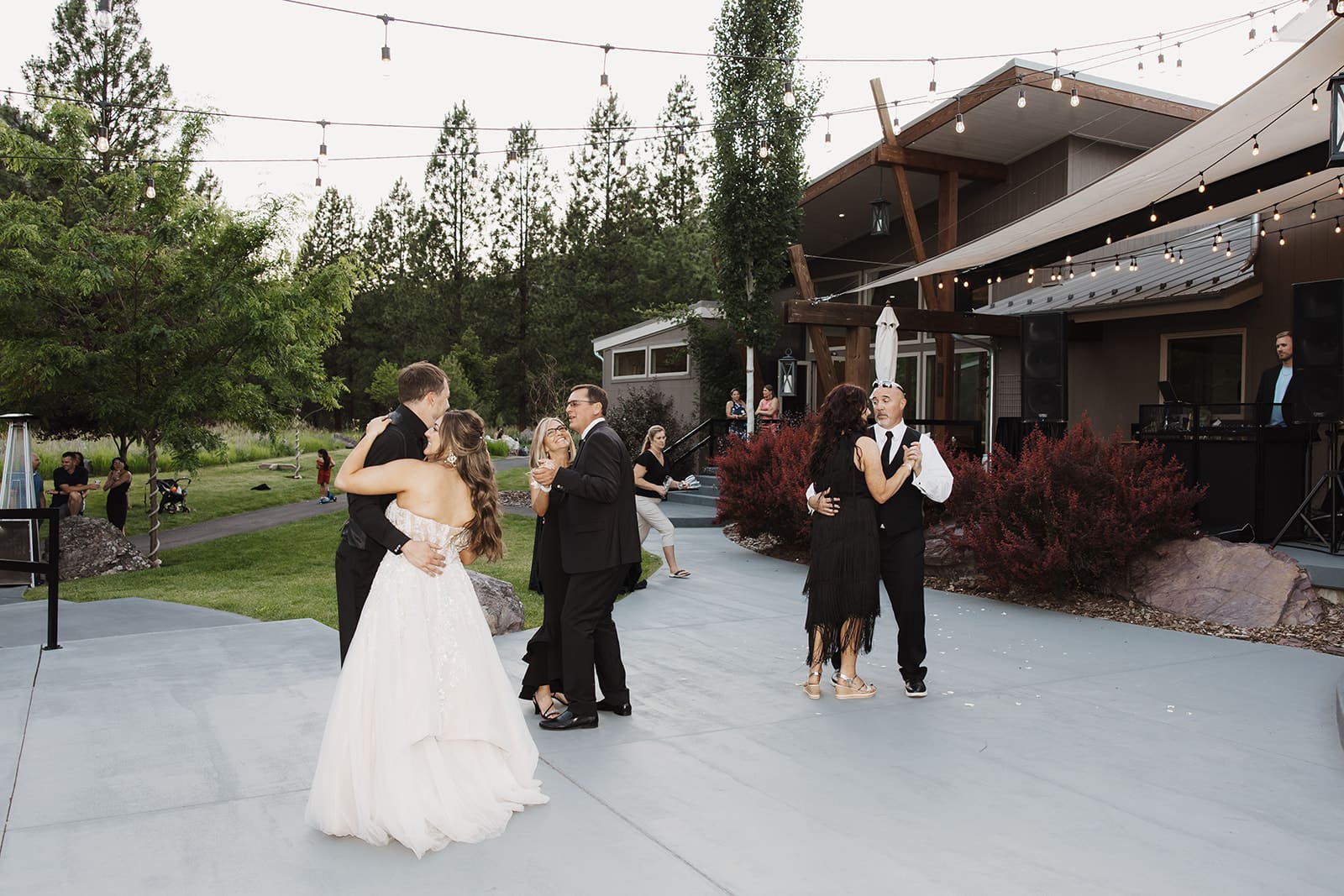 The reception came alive with love and celebration as the couple danced beneath twinkling lights at The White Raven.