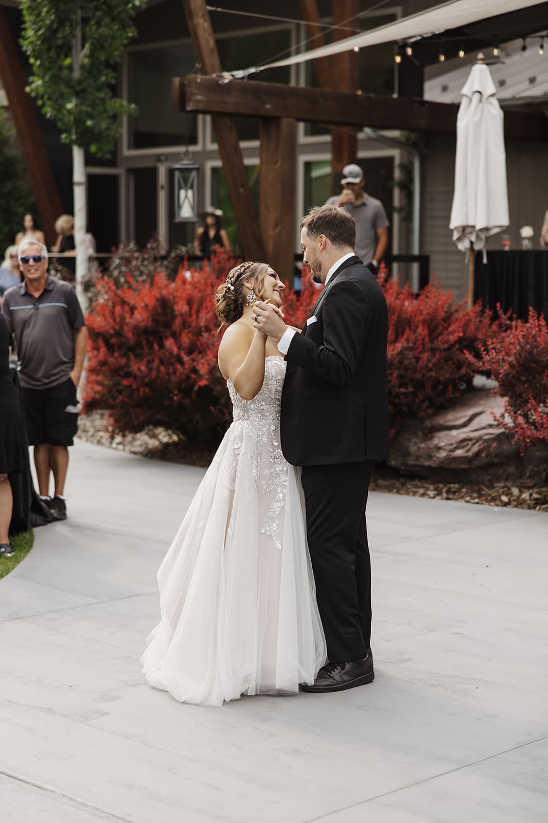 Bride and groom share their first dance during the wedding reception at The White Raven venue in Missoula, Montana.