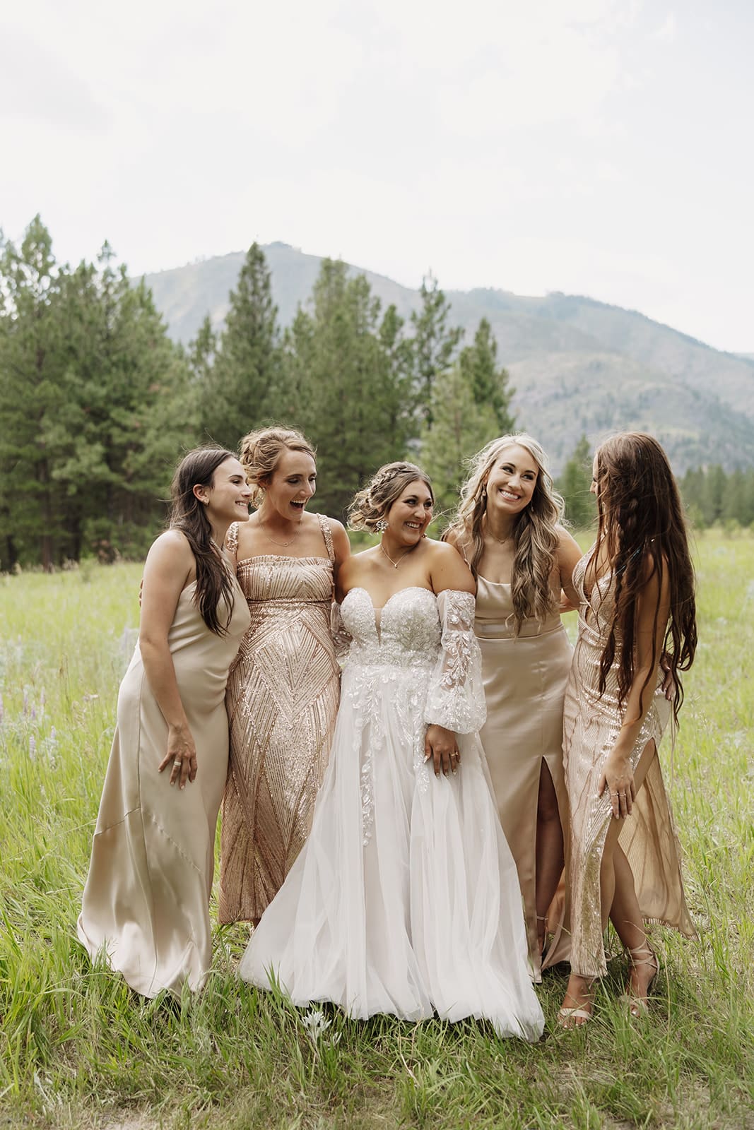 Bridesmaids and bride celebrating at The White Raven wedding venue near Missoula, Montana, with elegant attire, natural scenery, and joyful moments captured by Frazier & Co.