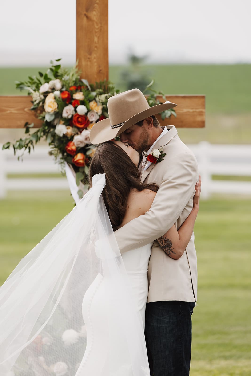 First kiss shared by bride and groom at montana wedding