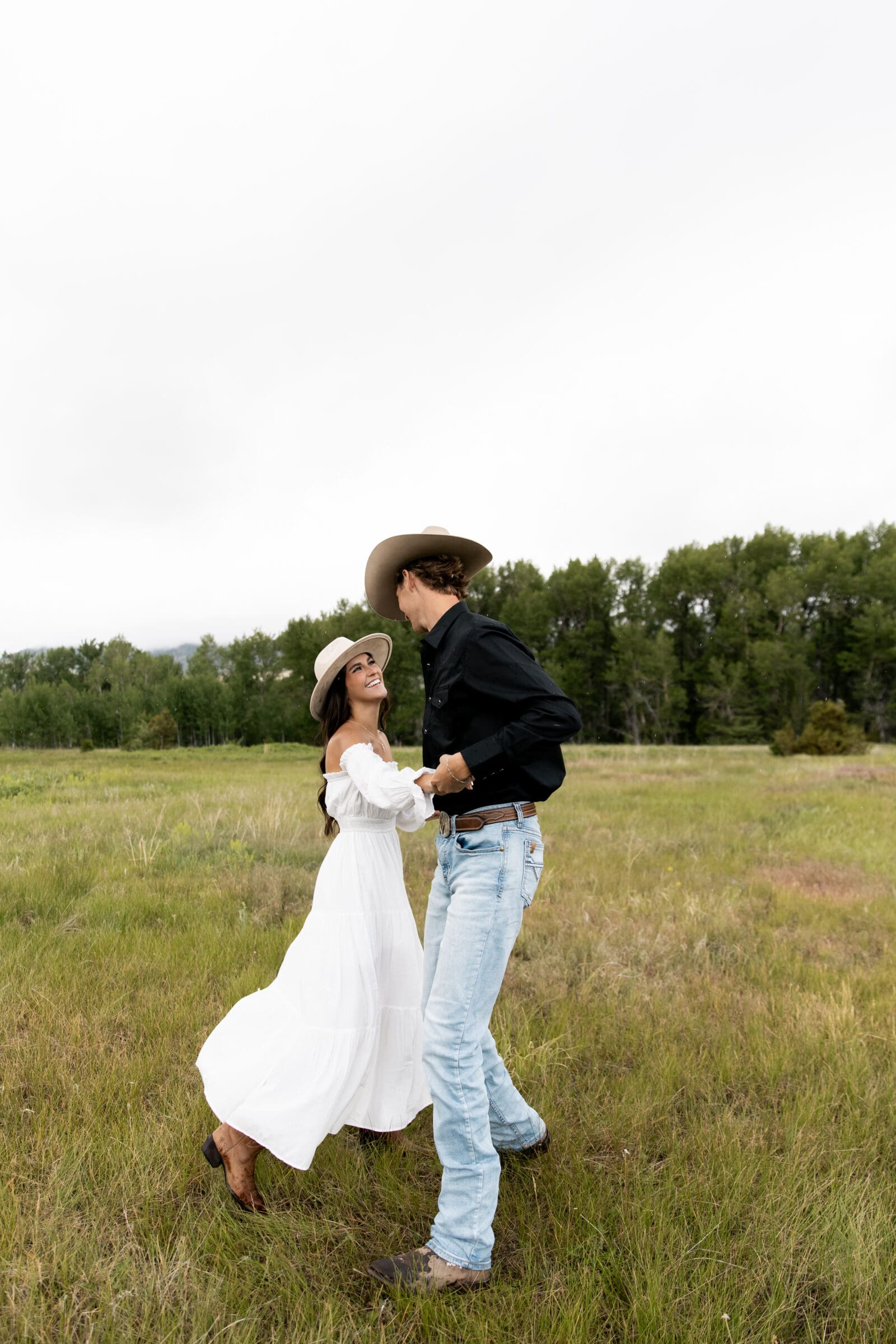 Engaged couple dancing during their whitefish engagement session
