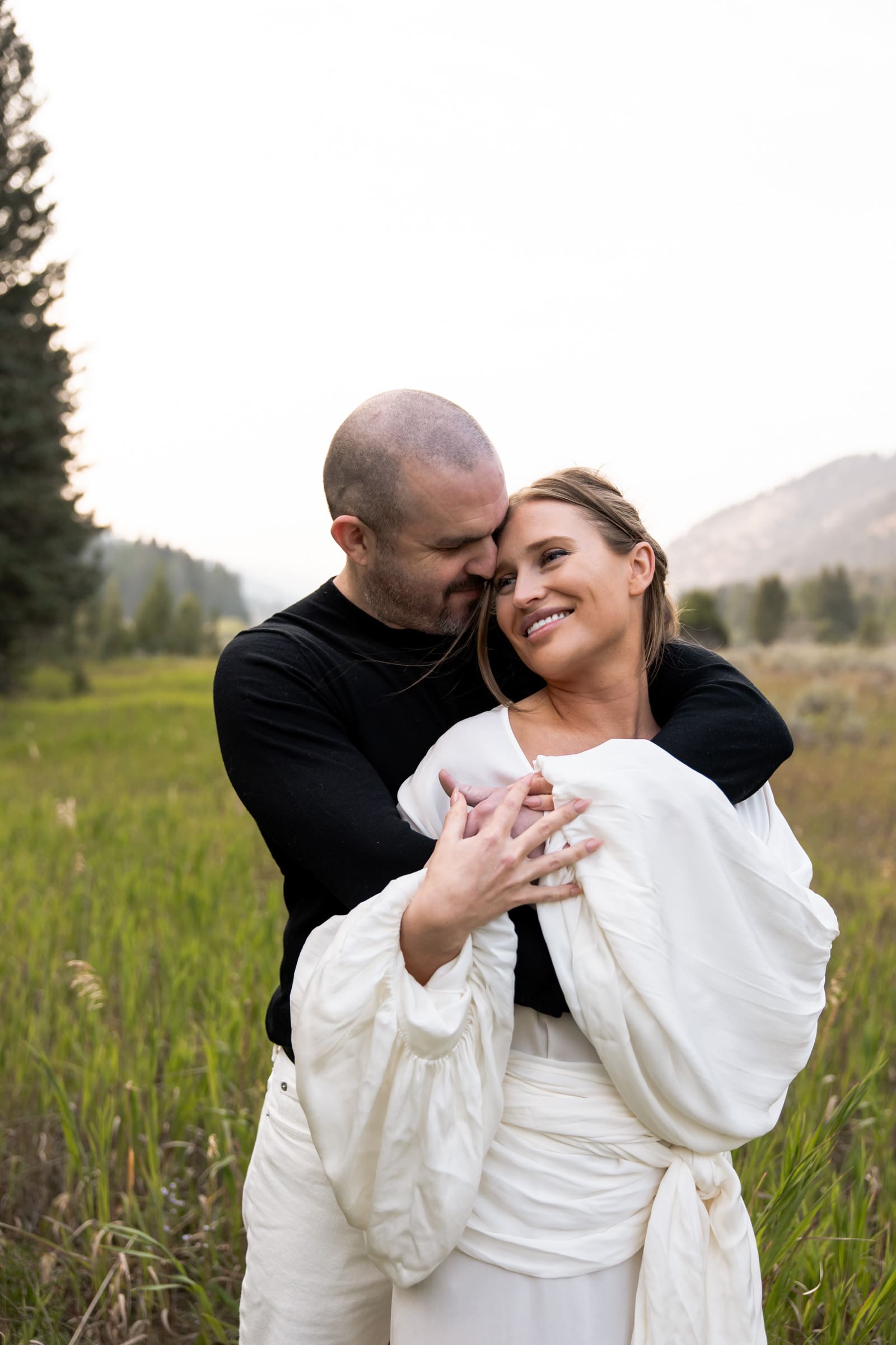 Destination couple celebrating love with exclusive Big Sky engagement photography.