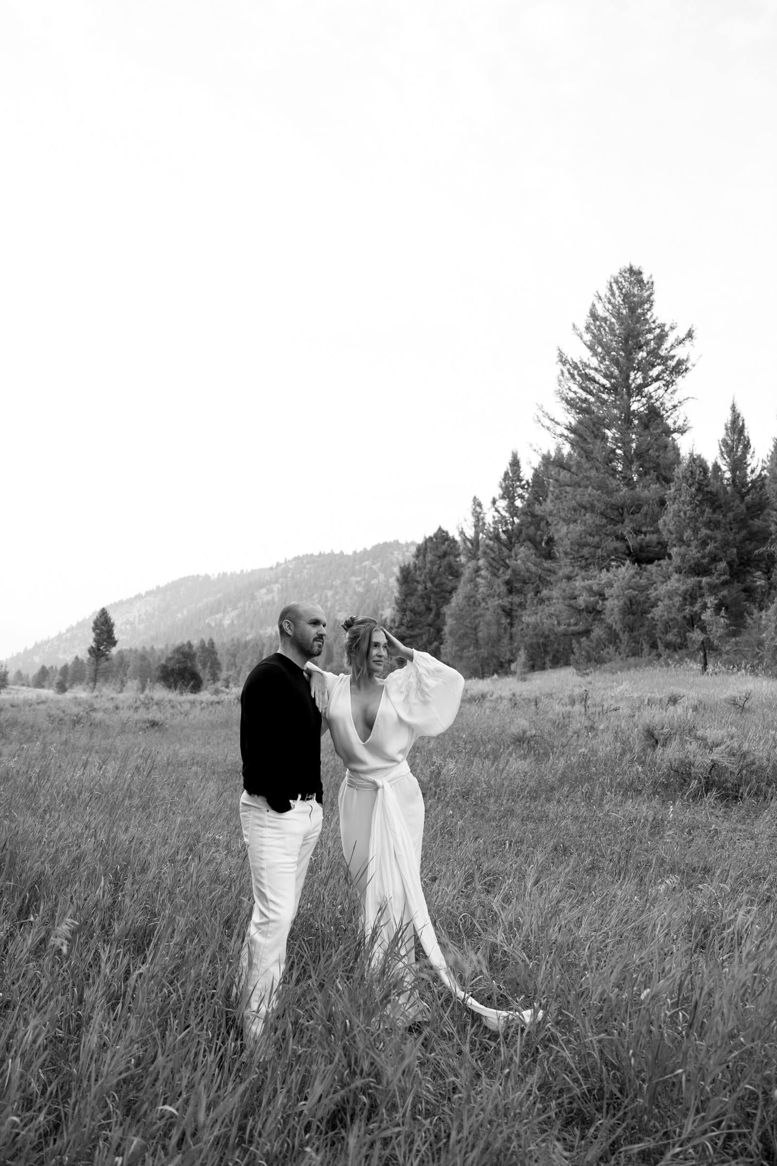 Romantic editorial engagement moment in the meadows near The Montage Big Sky