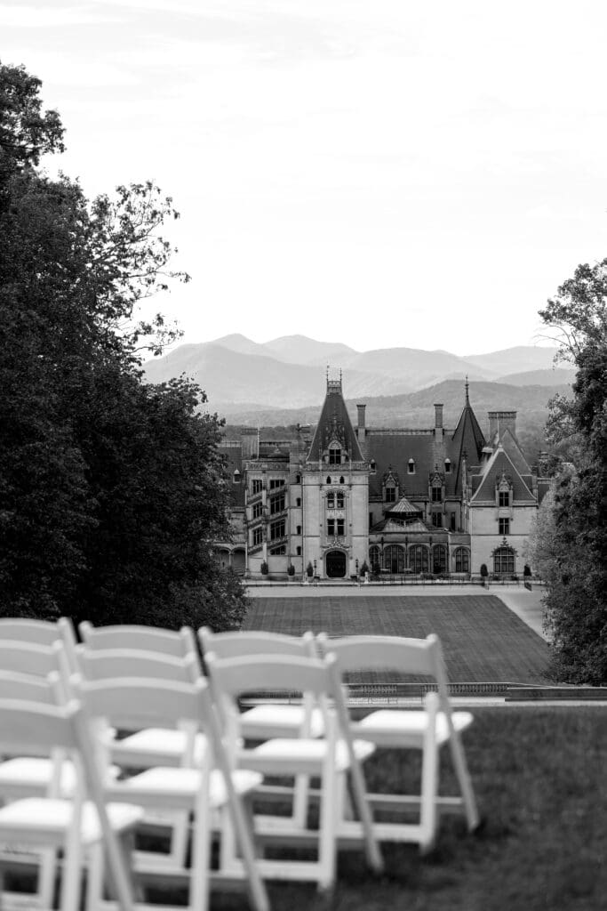 Black-and-white ceremony setup facing the Biltmore Estate, photographed by a Biltmore wedding photographer for timeless Biltmore wedding photos.