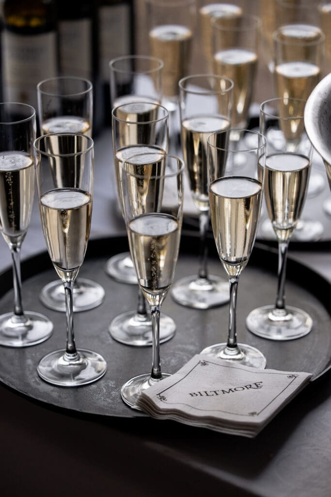 Champagne glasses arranged for toasts at the Biltmore Estate wedding reception.