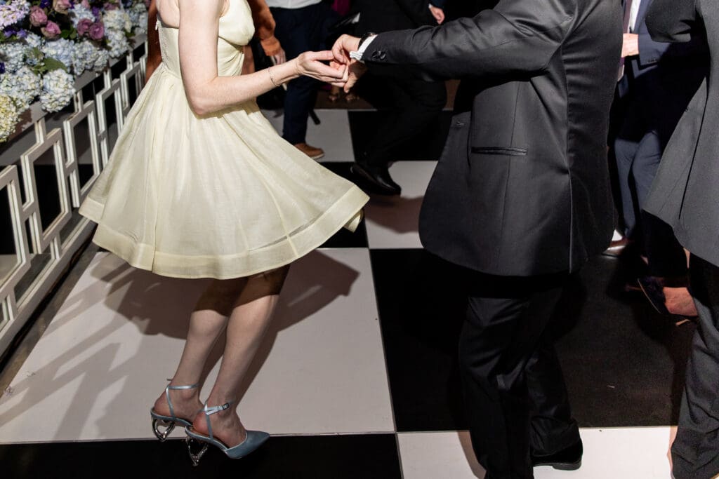 Close-up of guests dancing during the lively Biltmore Estate wedding reception.