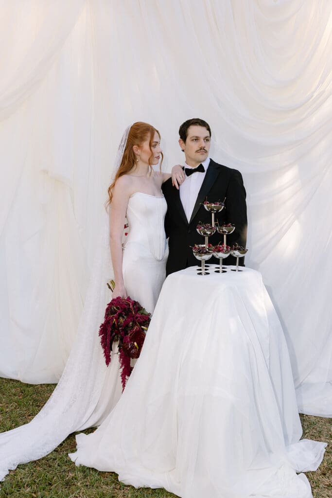 Editorial wedding couple posing outdoors at Santa Barbara estate wedding venue.