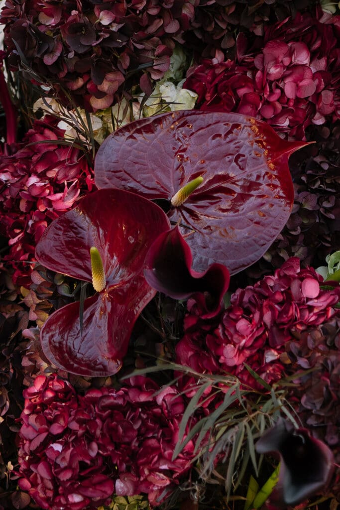 Close-up of deep burgundy wedding florals styled for Santa Barbara editorial destination wedding.