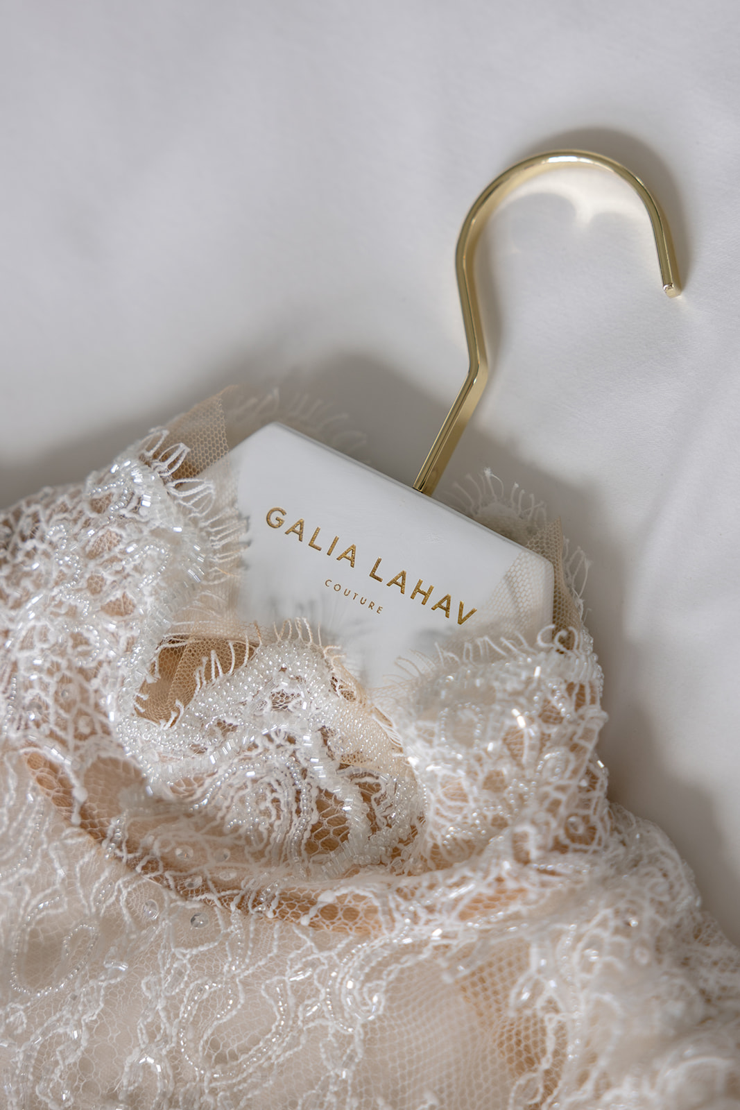 Galia Lahav Élysée wedding gown detail on a gold hanger before a Montage Big Sky wedding.