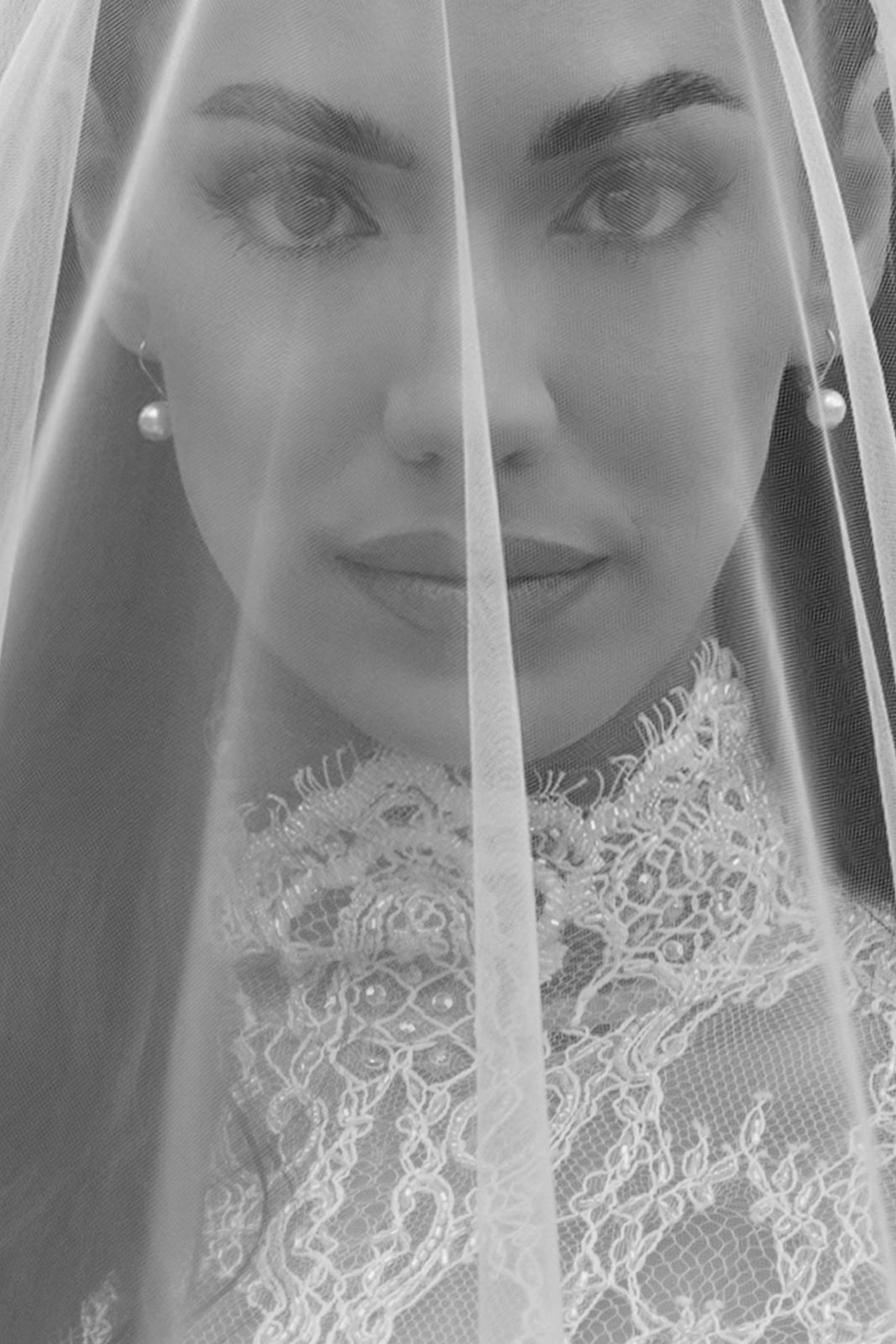 Black and white close-up portrait of bride in Galia Lahav Élysée gown and cathedral veil at Montage Big Sky